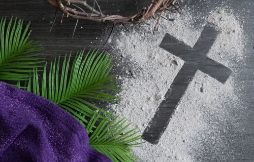 Ashes on table with cross symbol and palm fraunds