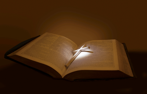 Open Bible with highlighted cross