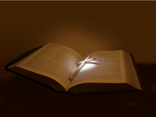 Open Bible with highlighted cross