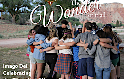 People in a group hug outside