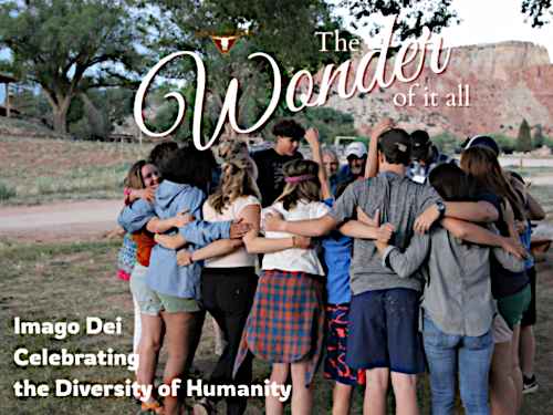 People in a group hug outside