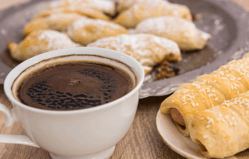 Cup of coffee and plate of pastries