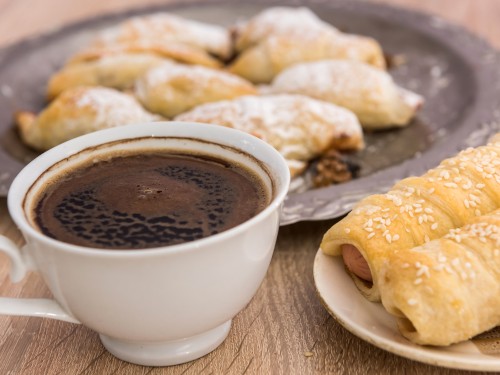 Cup of coffee and plate of pastries