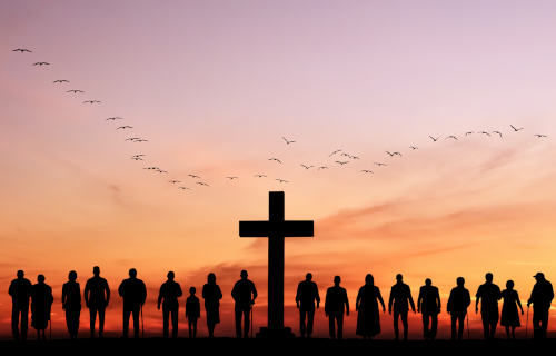 Cross in sunset with people silhouettes around it