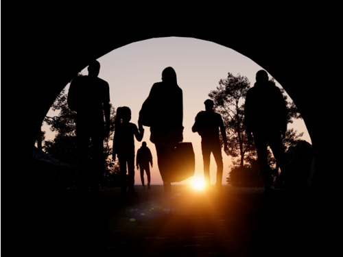 Silhouette of famil traveling through a tunnel