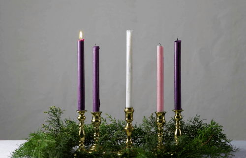 Four Advent candles with first candle lit
