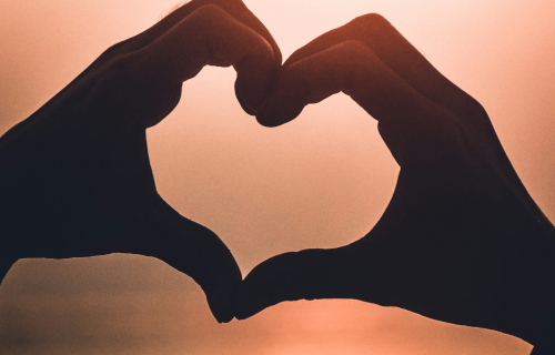 Two hands in the shape of a heart