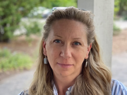 Portrait of Kate Field with plants in the background