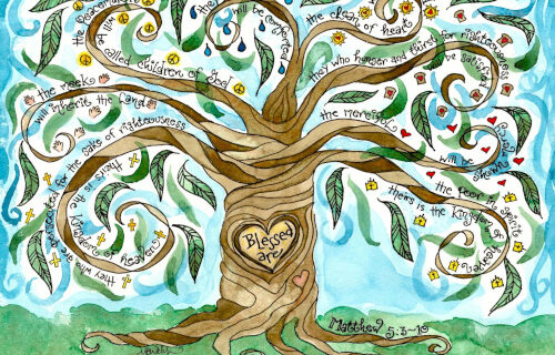 A painting of a tree with The Beatitudes written next to and on it.