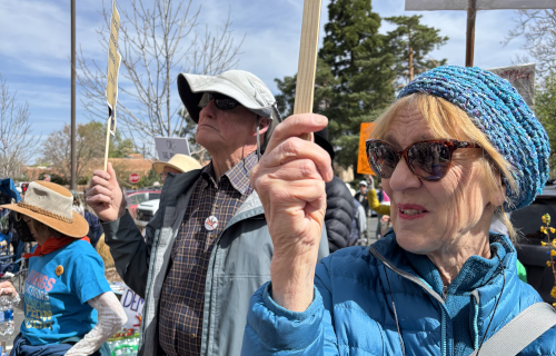 People holding protest signs