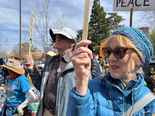 People holding protest signs