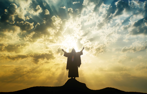 Prophet standing on mountain with arms up to sky