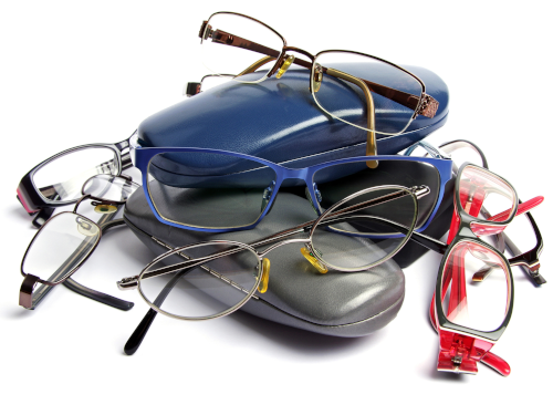 Pile of assorted eyeglasses and cases