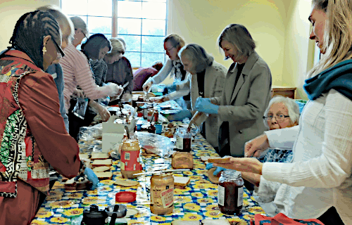 Volunteers making sandwiches in Pope Hall