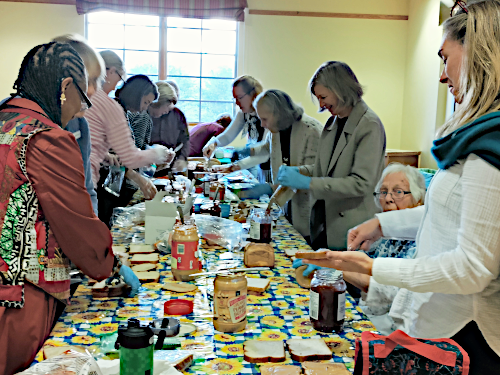 Volunteers making sandwiches in Pope Hall