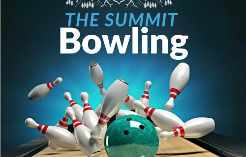 Bowling ball knocking down pins