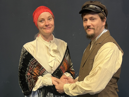 two characters dressed in clothes from A Fiddler on the Roof