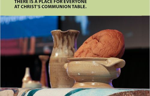 Earthen wine jar and bread loaf with "There is a place for everyone at Christ's communion table.