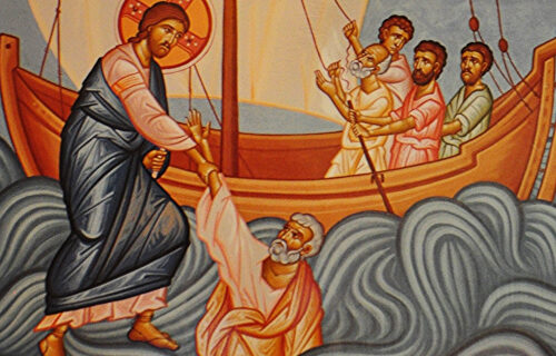 Jesus on the water pulling Peter up next to the boat