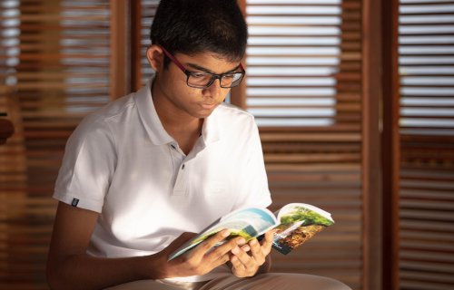 Young man reading a book