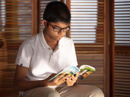 Young man reading a book